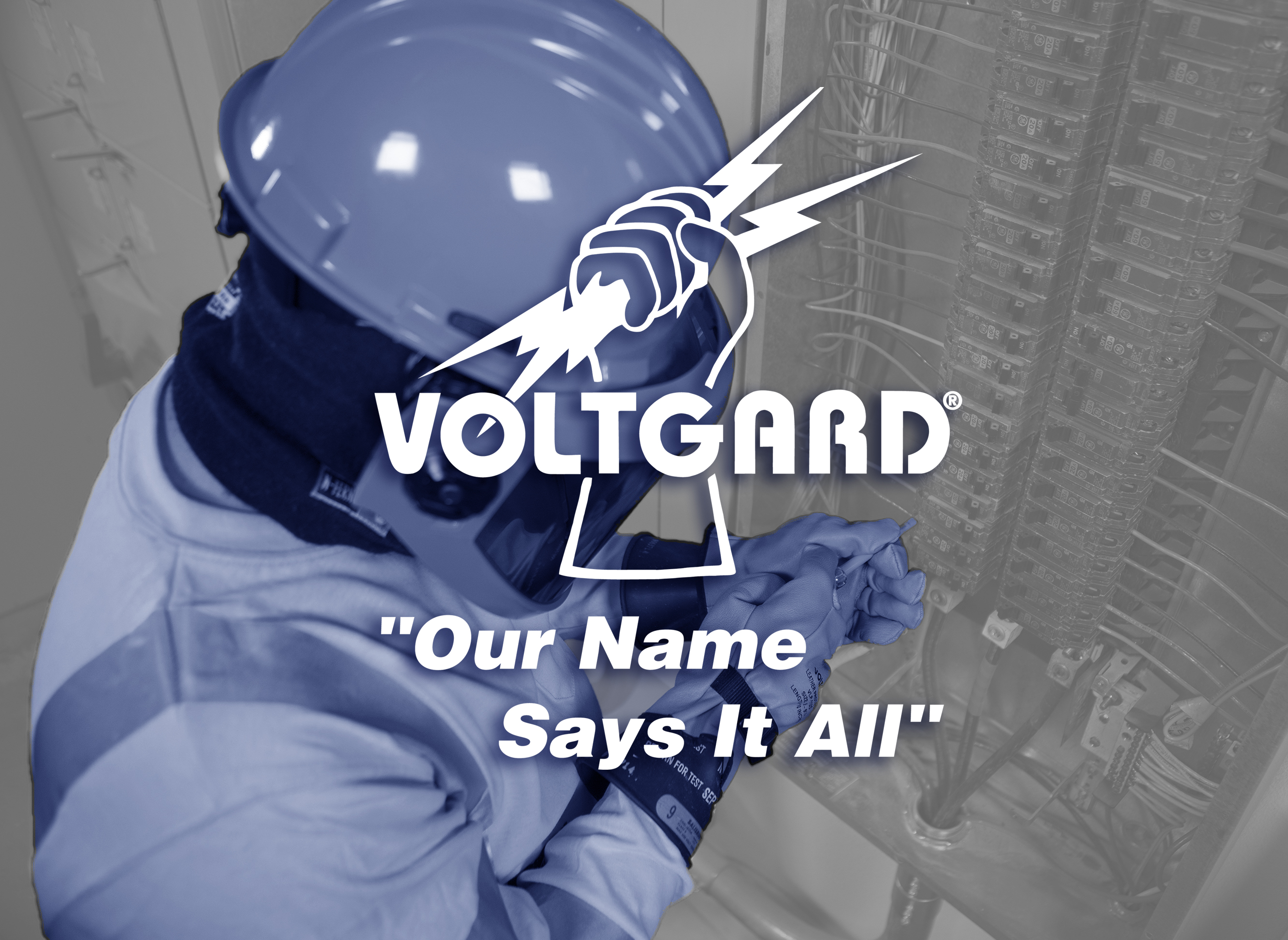 Electrical Worker Wearing Gloves Working On A Panel With Voltgard Logo